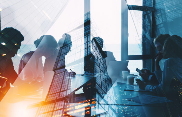 Enterprise AI ROI and the Capital Efficiency Gap Executives reviewing financial performance data on a dashboard during a technology investment discussion