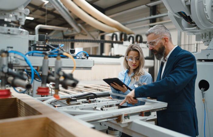 EU Digital Product Passport for U.S. Manufacturers Manufacturing production line with digital data connections linking products to a central record