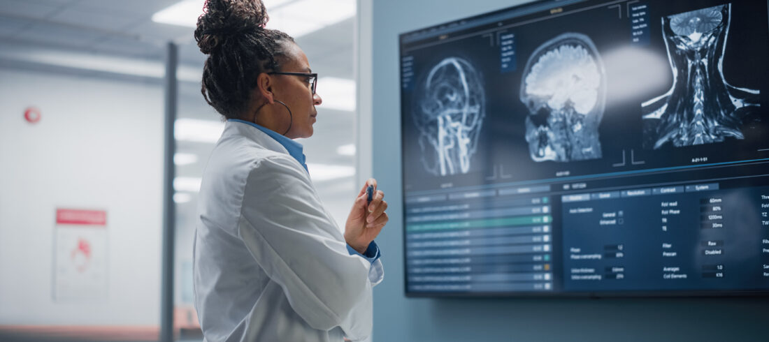 Radiology scans on a monitor being analyzed by a medtech AI model