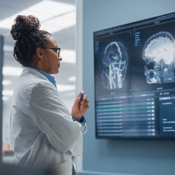 Radiology scans on a monitor being analyzed by a medtech AI model