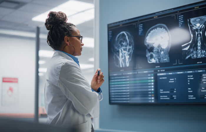 Radiology scans on a monitor being analyzed by a medtech AI model