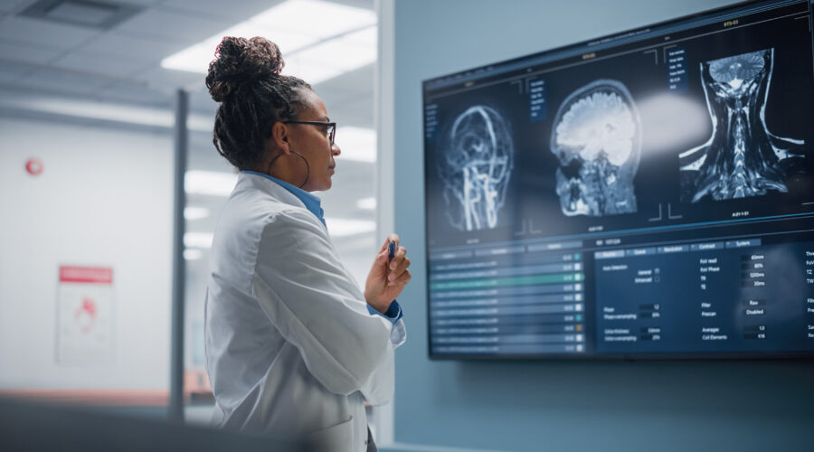 Radiology scans on a monitor being analyzed by a medtech AI model